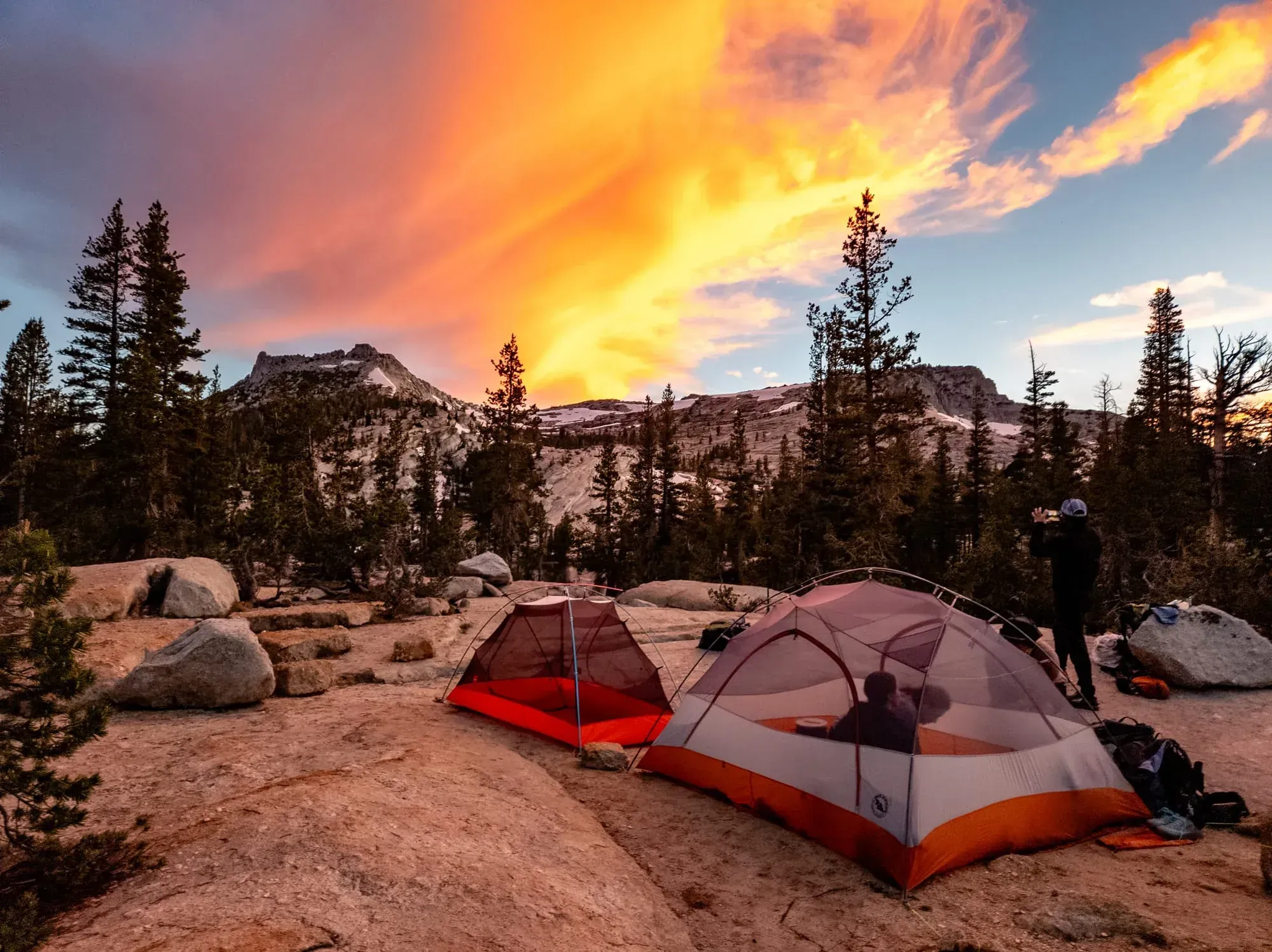 Backpacking camp on granite at sunset in the Yosemite High Sierra