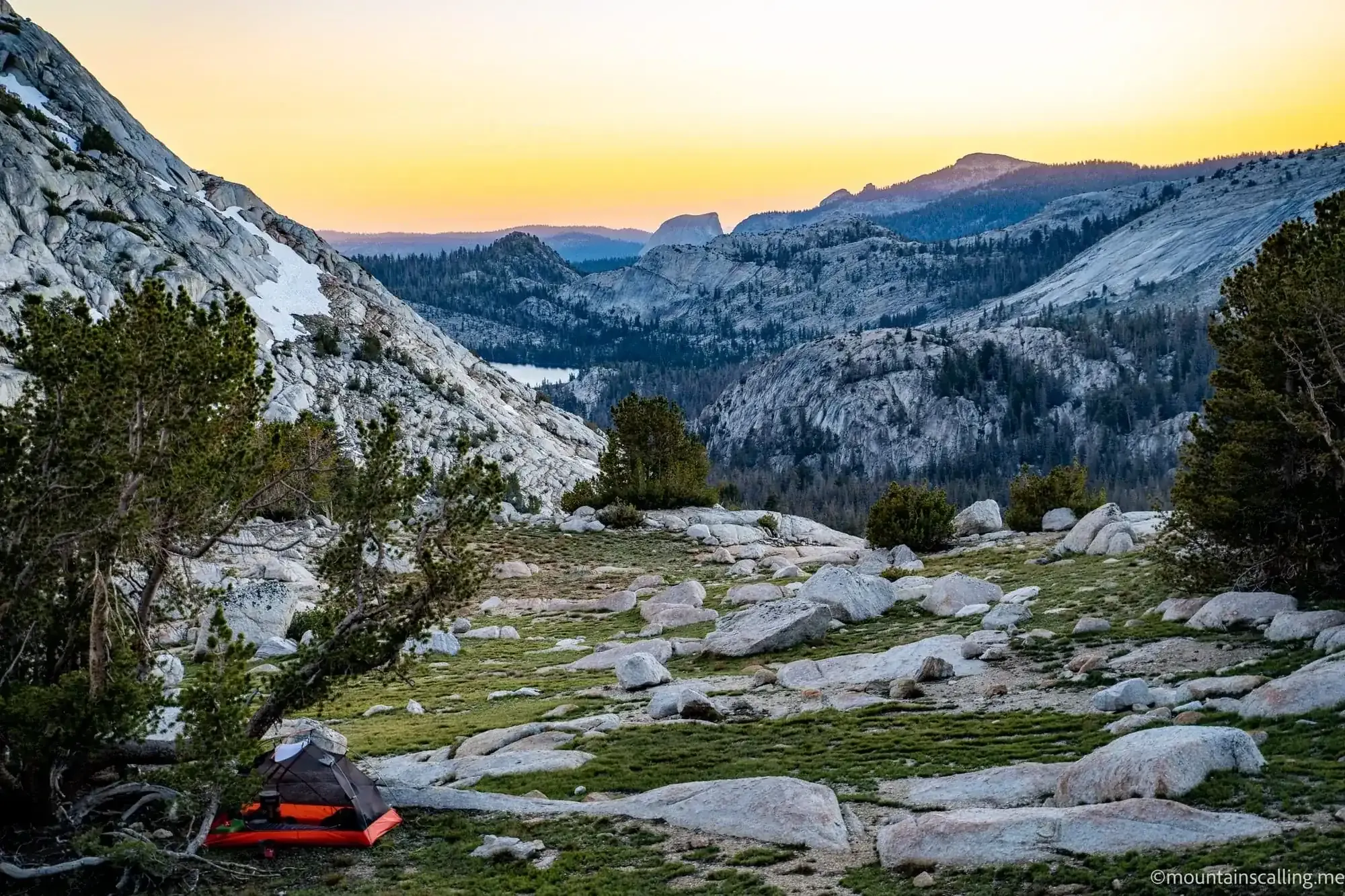 Backpacking tent at sunset campsite near Vogelsang Pass with Half Dome visible in distance, Yosemite wilderness
