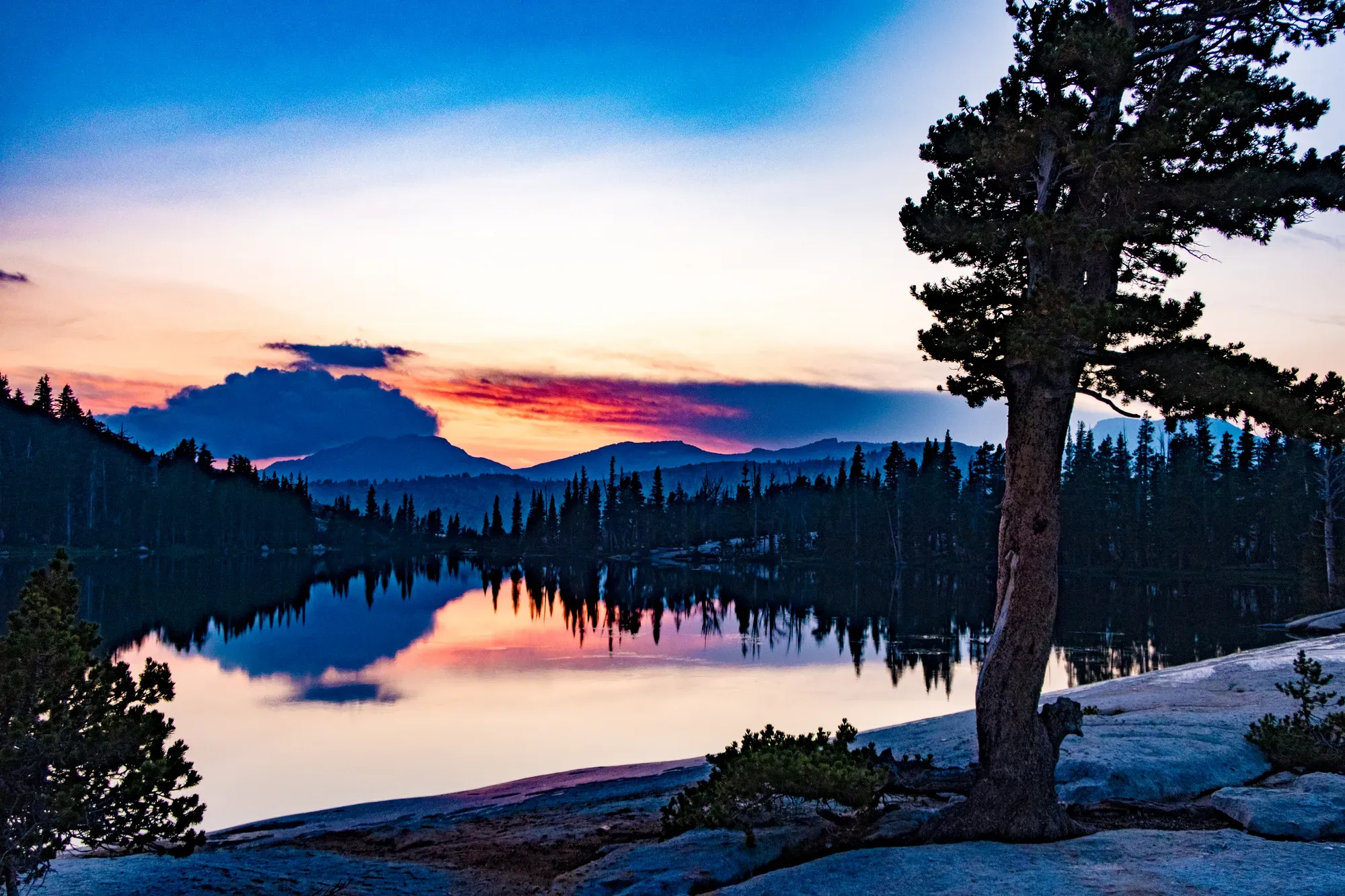 Sunset over Cathedral Lake in Yosemite high country during a guided alpine backpacking trip