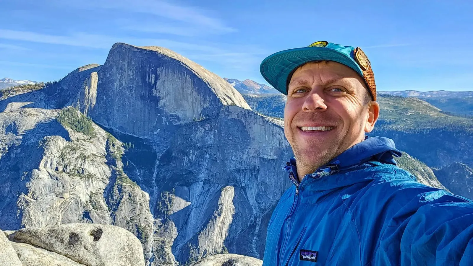Eric Kufrin, Yosemite guide, on North Dome with Half Dome in the background