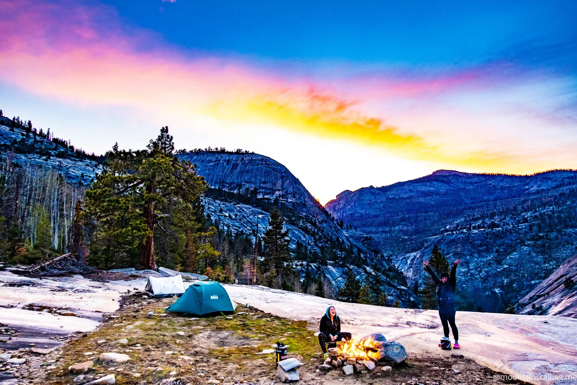 Guided backpacking group at a granite campsite during sunset in the Yosemite High Sierra