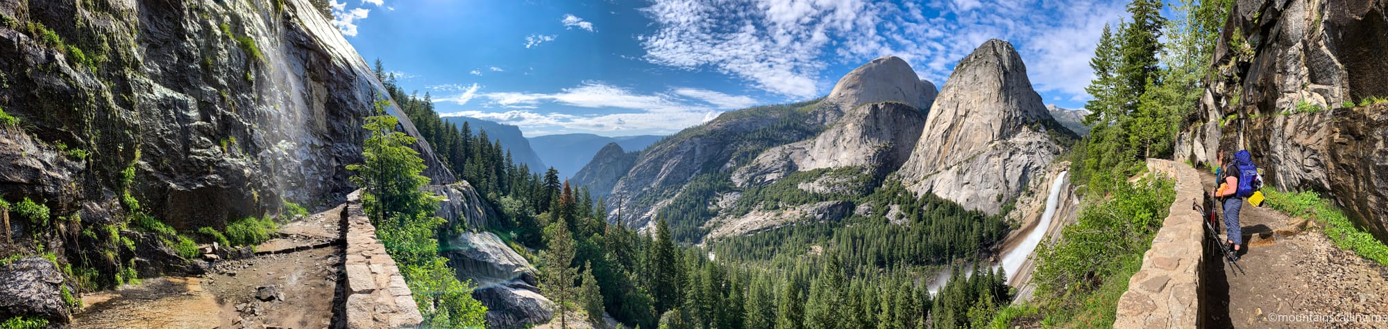 Panoramic view from the Ice Cut on the John Muir Trail showing the carved stone path, Nevada Fall, Liberty Cap, and Half Dome in Yosemite National Park | Yosemite Life | Yosemite.Life