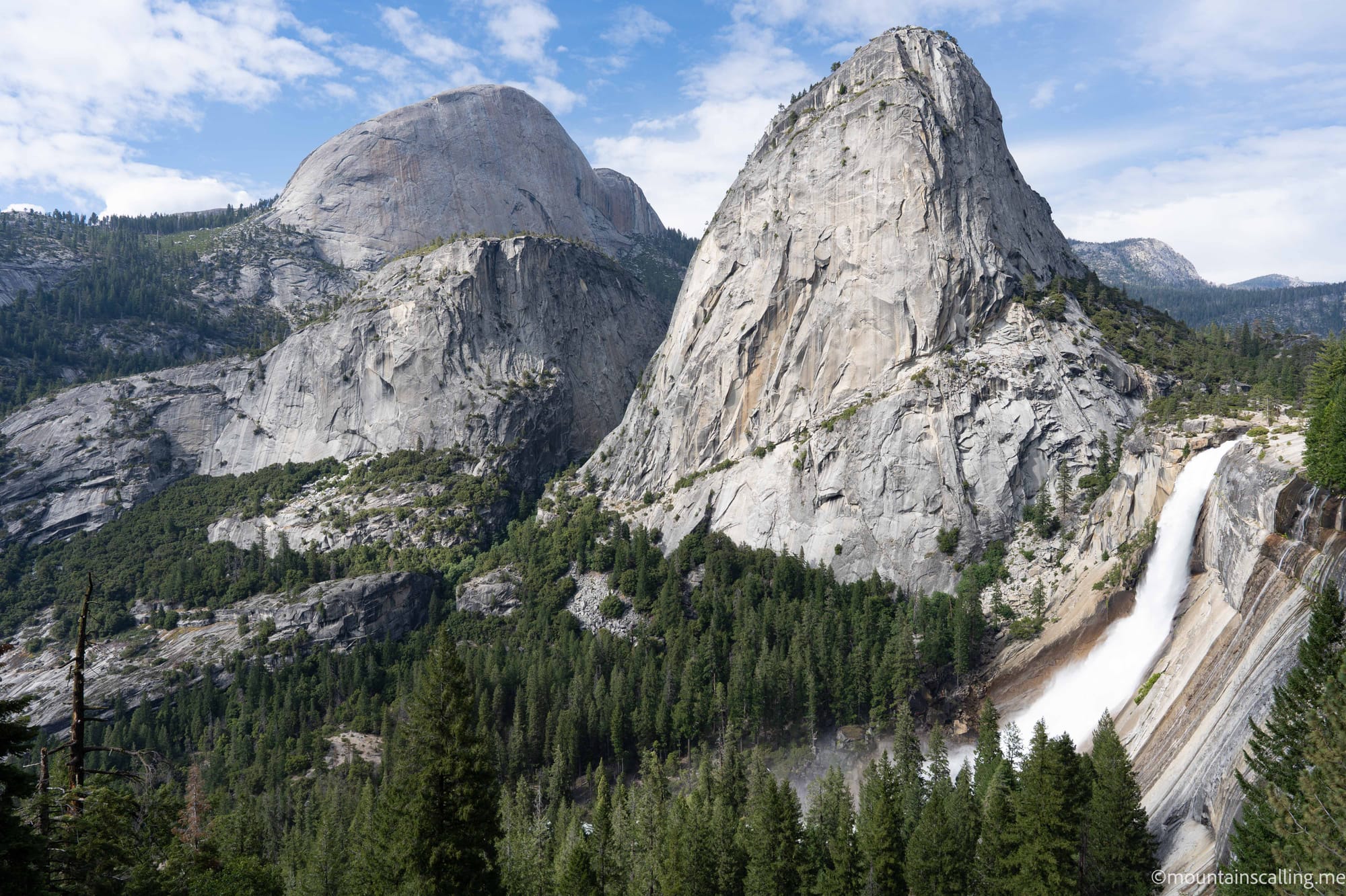 Nevada Fall flowing beside Liberty Cap with Half Dome in the background viewed from Clark Point on the John Muir Trail in Yosemite | Yosemite Life | Yosemite.Life