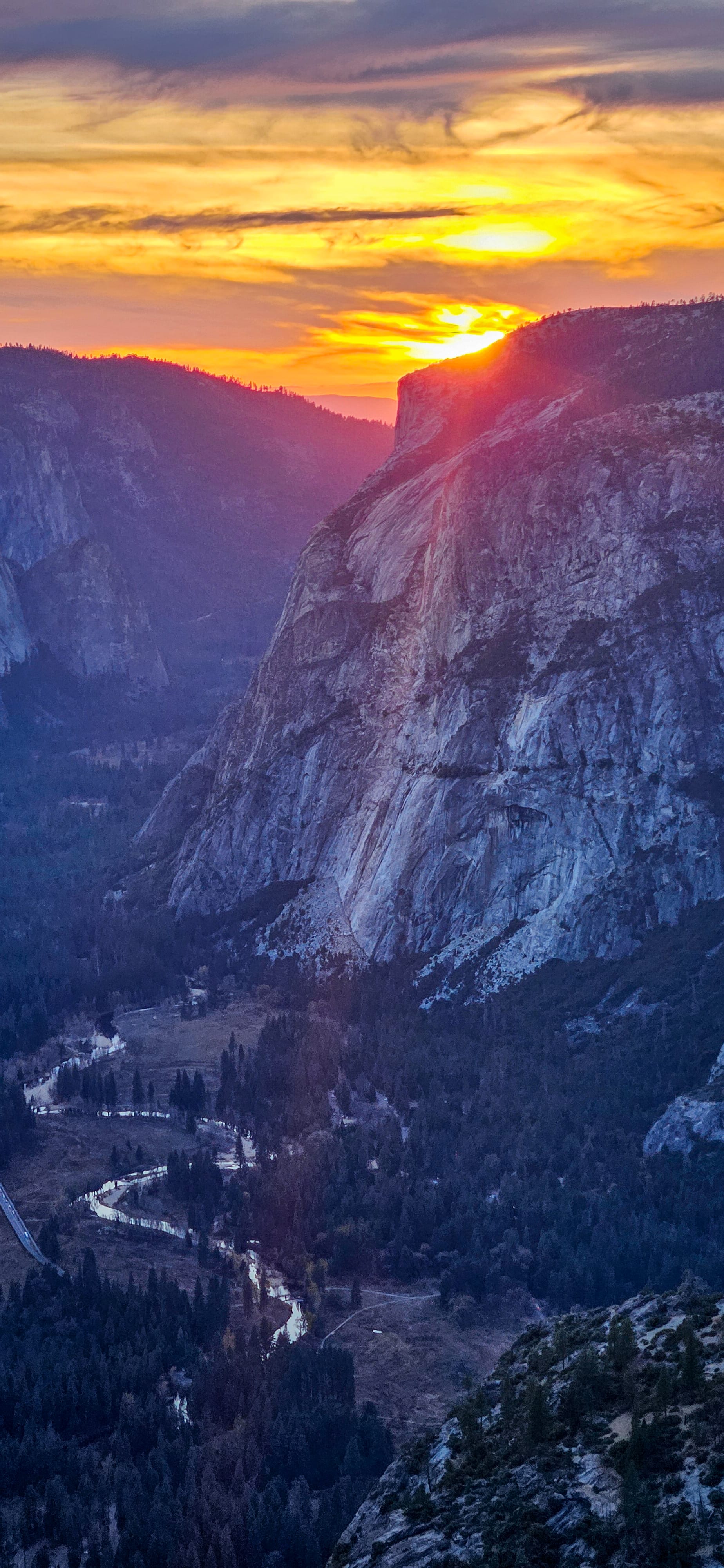 East side of El Cap at sunset with a golden sunset, Merced River below