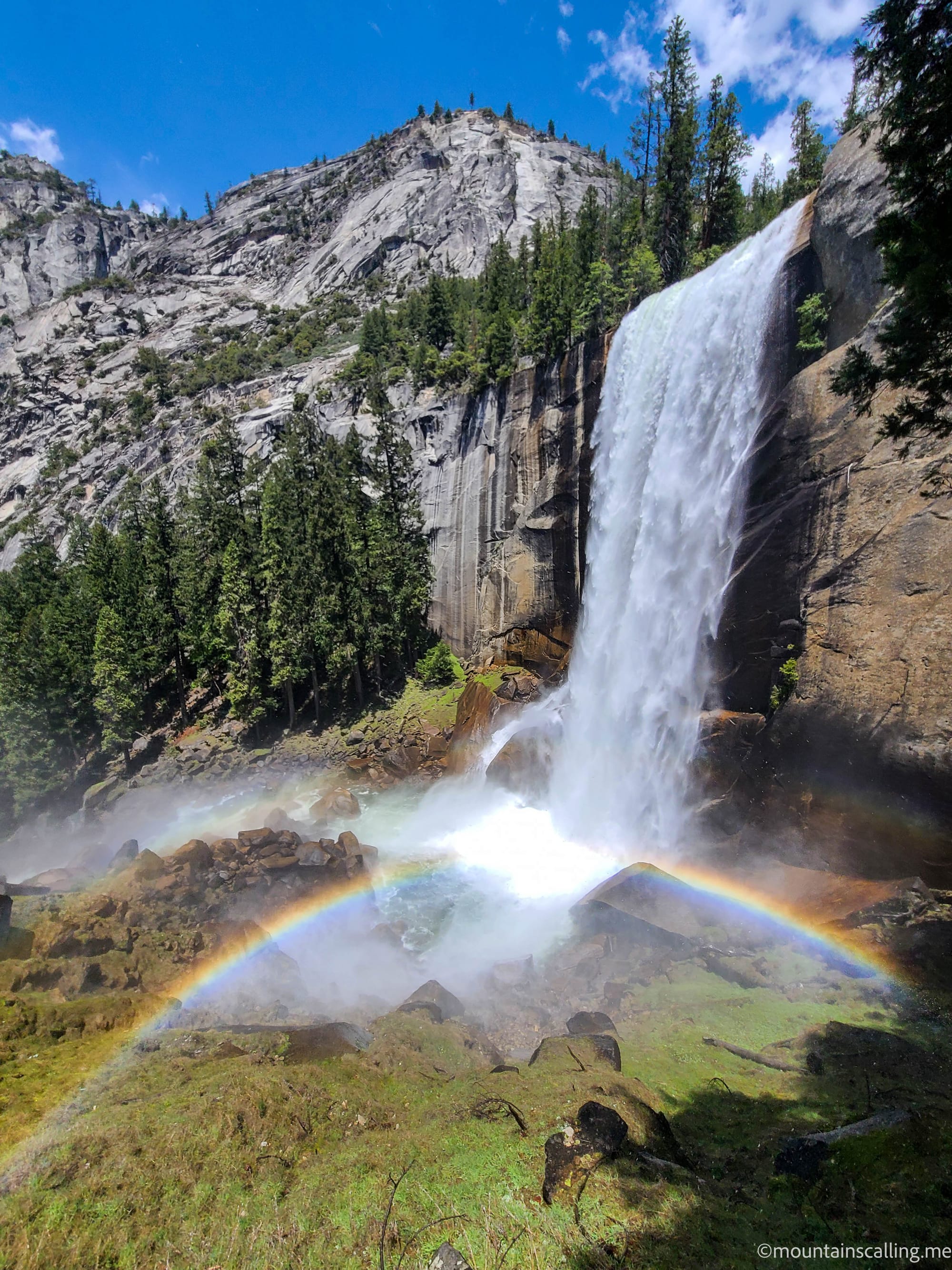 Vernal Fall in Yosemite National Park with a full rainbow in the mist at the base of the granite staircase on the Mist Trail | Yosemite Life | Yosemite.Life