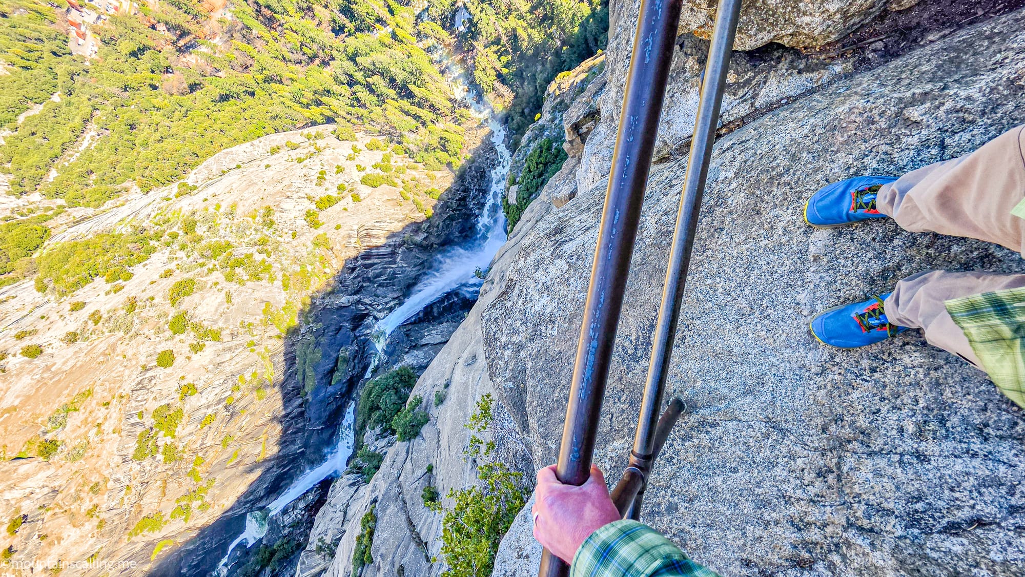 Eric Kufrin hanging on to the railing at OMG Point | Yosemite Life | Yosemite.Life